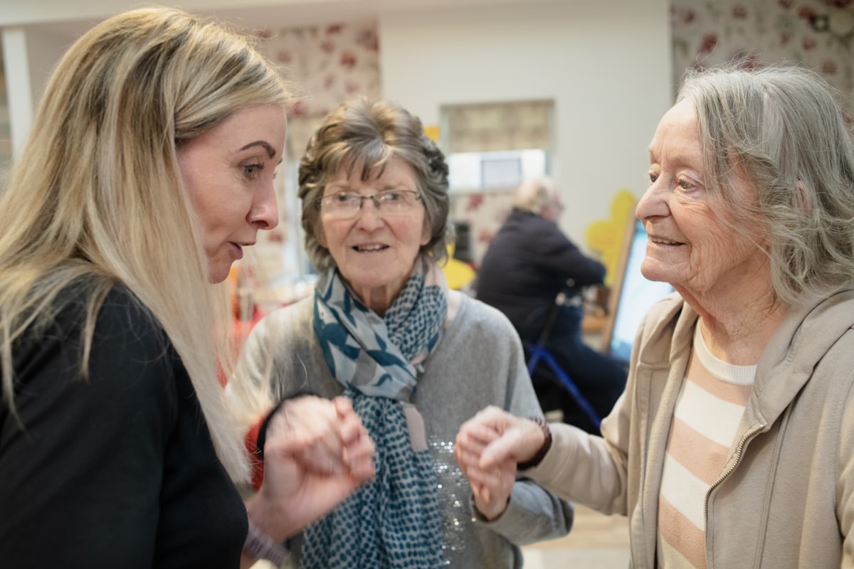 Family members interacting warmly together while coordinating care
